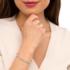 Thumbnail Image 2 of Oval White Lab-Created Sapphire and 0.18 CT. T.W. Diamond Infinity Ribbon Link Line Bracelet in Sterling Silver – 7.5"