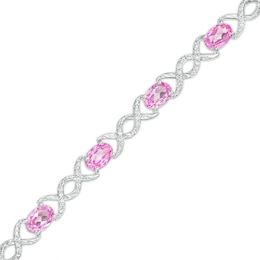 Oval Pink Lab-Created Sapphire and 0.18 CT. T.W. Diamond Infinity Ribbon Link Line Bracelet in Sterling Silver – 7.5"