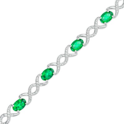 Oval Lab-Created Emerald and 0.18 CT. T.W. Diamond Infinity Ribbon Link Line Bracelet in Sterling Silver – 7.5"