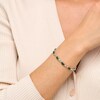Thumbnail Image 2 of Oval Lab-Created Emerald and 0.18 CT. T.W. Diamond Infinity Ribbon Link Line Bracelet in Sterling Silver – 7.5"