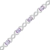 Thumbnail Image 1 of Oval Lab-Created Alexandrite and 0.18 CT. T.W. Diamond Infinity Ribbon Link Line Bracelet in Sterling Silver – 7.5"