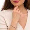 Thumbnail Image 2 of Oval Lab-Created Alexandrite and 0.18 CT. T.W. Diamond Infinity Ribbon Link Line Bracelet in Sterling Silver – 7.5"