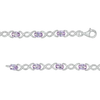 Oval Lab-Created Alexandrite and 0.18 CT. T.W. Diamond Infinity Ribbon Link Line Bracelet in Sterling Silver – 7.5"