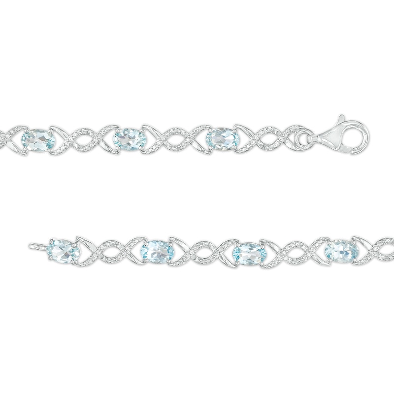 Main Image 3 of Oval Aquamarine and 0.18 CT. T.W. Diamond Infinity Ribbon Link Line Bracelet in Sterling Silver – 7.5"
