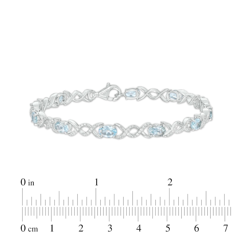 Main Image 4 of Oval Aquamarine and 0.18 CT. T.W. Diamond Infinity Ribbon Link Line Bracelet in Sterling Silver – 7.5"