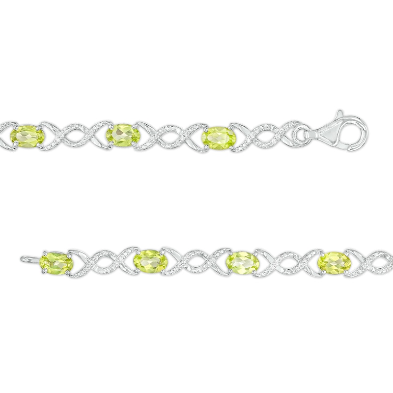 Main Image 3 of Oval Peridot and 0.18 CT. T.W. Diamond Infinity Ribbon Link Line Bracelet in Sterling Silver – 7.5"