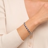 Thumbnail Image 2 of 4.5mm Blue Lab-Created Sapphire and 0.14 CT. T.W. Diamond Alternating "XO" Line Bracelet in Sterling Silver – 7.5"