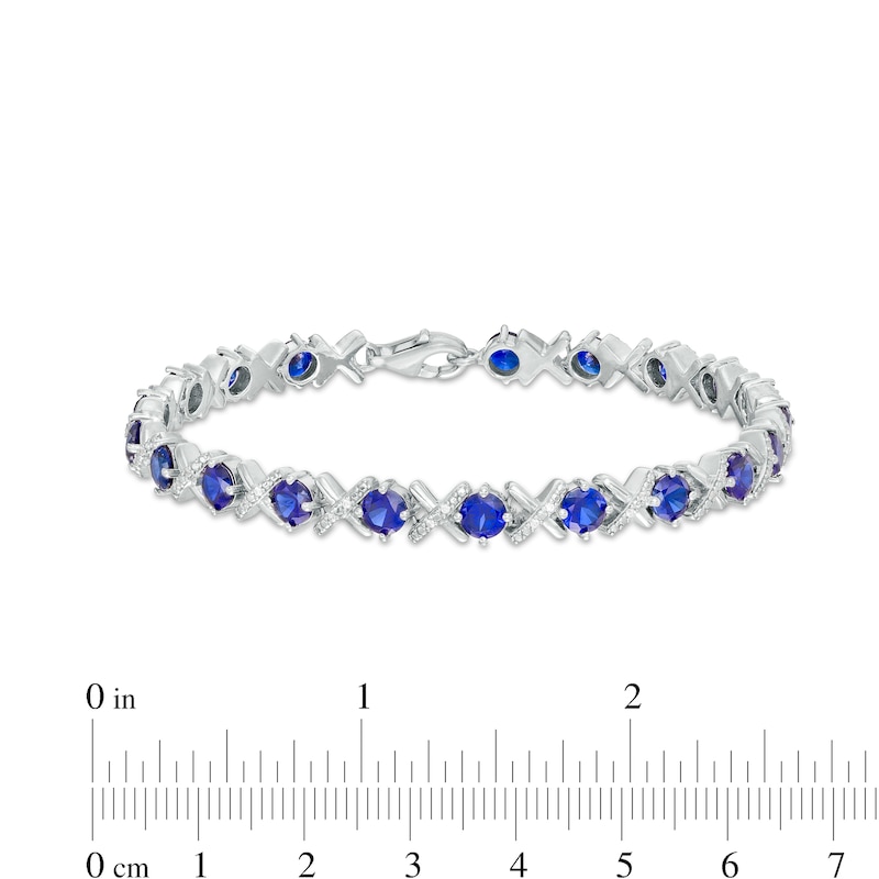Main Image 4 of 4.5mm Blue Lab-Created Sapphire and 0.14 CT. T.W. Diamond Alternating "XO" Line Bracelet in Sterling Silver – 7.5"