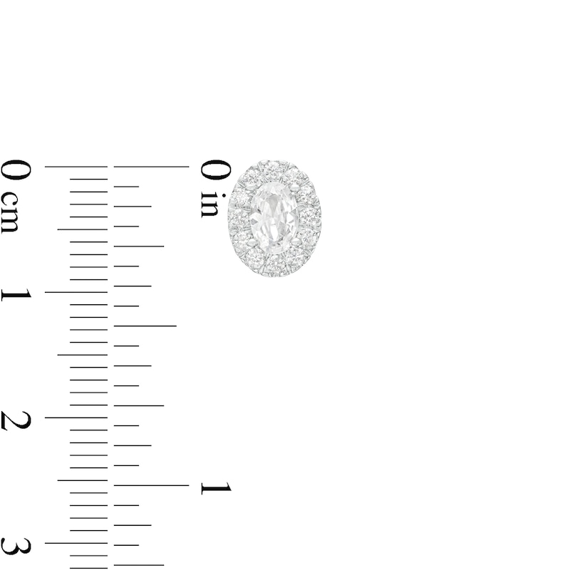 0.75 CT. T.W. Certified Canadian Oval Diamond Frame Stud Earrings in 14K White Gold (I/I2)