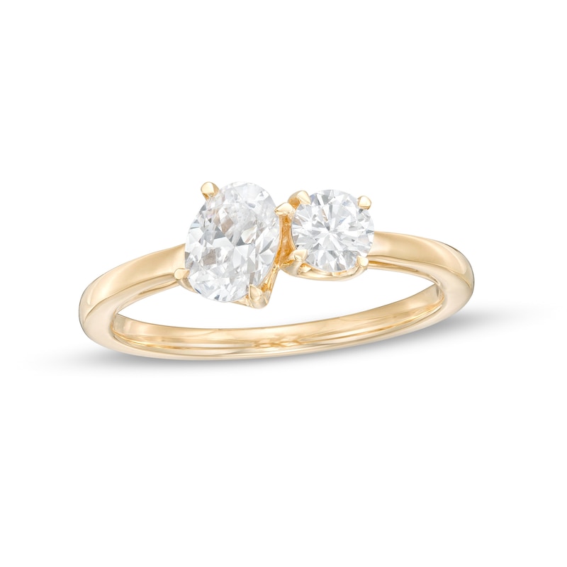 0.75 CT. T.W. Oval and Round Diamond Duo Engagement Ring in 14K Gold