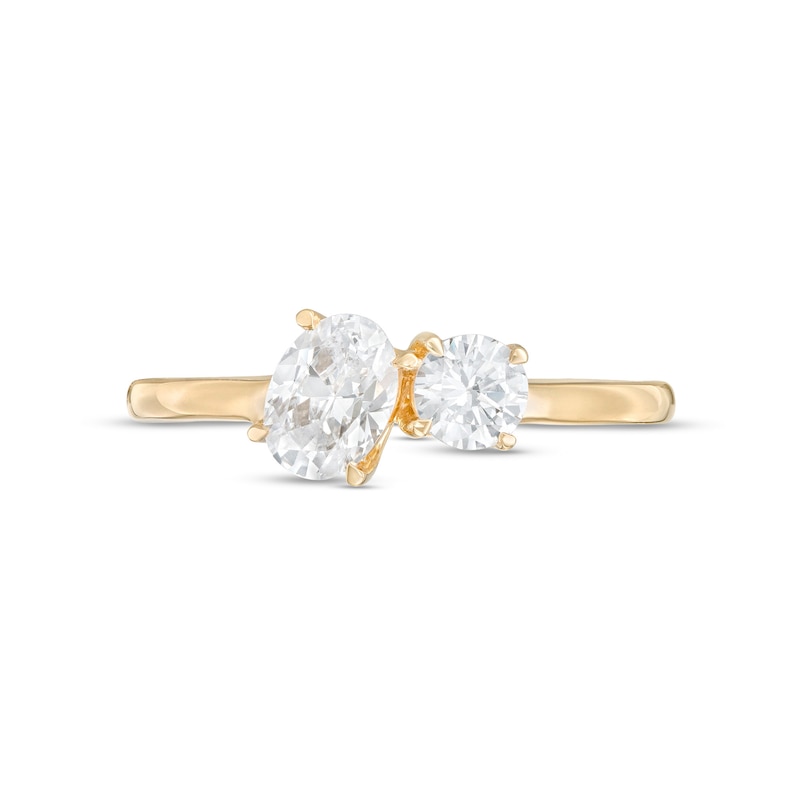 0.75 CT. T.W. Oval and Round Diamond Duo Engagement Ring in 14K Gold