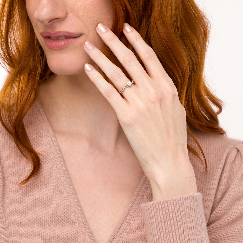Main Image 2 of 0.15 CT. T.W. Heart-Shaped Multi-Diamond Twist Shank Promise Ring in Sterling Silver