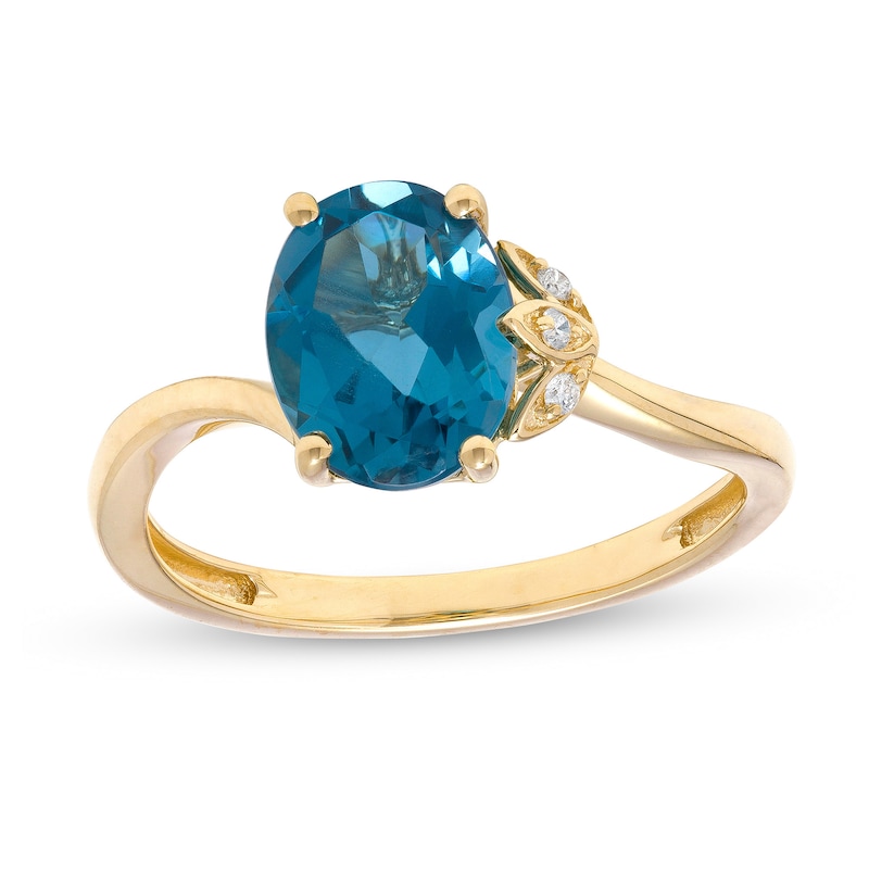 Oval London Blue Topaz and Diamond Accent Bypass Flower Ring in 10K Gold