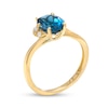 Oval London Blue Topaz and Diamond Accent Bypass Flower Ring in 10K Gold