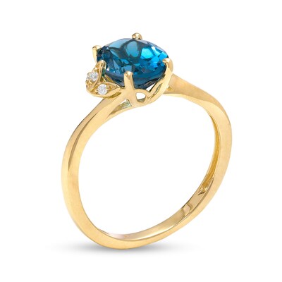 Oval London Blue Topaz and Diamond Accent Bypass Flower Ring in 10K Gold