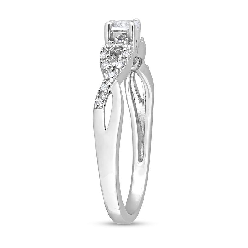 Oval White Lab-Created Sapphire and 0.08 CT. T.W. Diamond Twist Split Shank Promise Ring in Sterling Silver