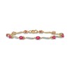 Thumbnail Image 1 of Oval Ruby and 0.16 CT. T.W. Diamond Wave Link Alternating Line Bracelet in 14K Gold - 7.25"