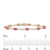 Thumbnail Image 4 of Oval Ruby and 0.16 CT. T.W. Diamond Wave Link Alternating Line Bracelet in 14K Gold - 7.25"