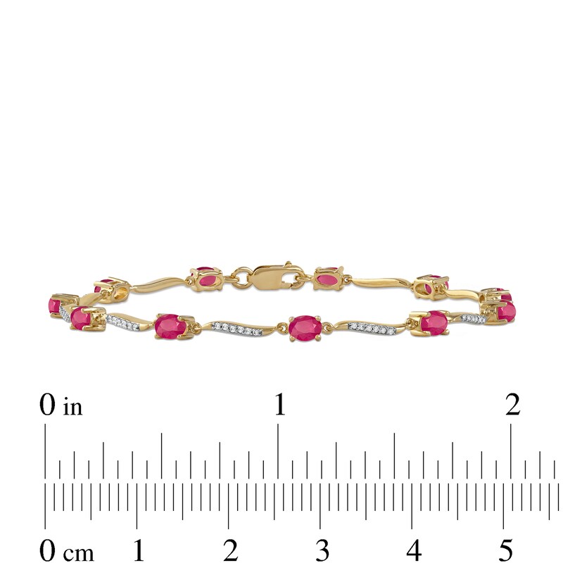 Oval Ruby and 0.16 CT. T.W. Diamond Wave Link Alternating Line Bracelet in 14K Gold - 7.25"