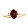 Thumbnail Image 1 of Oval Faceted Garnet and 0.05 CT. T.W. Diamond Side Accent Ring in 14K Gold