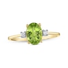 Thumbnail Image 0 of Oval Faceted Peridot and 0.05 CT. T.W. Diamond Side Accent Ring in 14K Gold