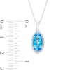 Oval Swiss Blue Topaz and 0.10 CT. T.W. Diamond Frame Pendant in 10K White Gold