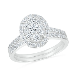 0.96 CT. T.W. Oval-Shaped Multi-Diamond Frame Bridal Set in 10K White Gold