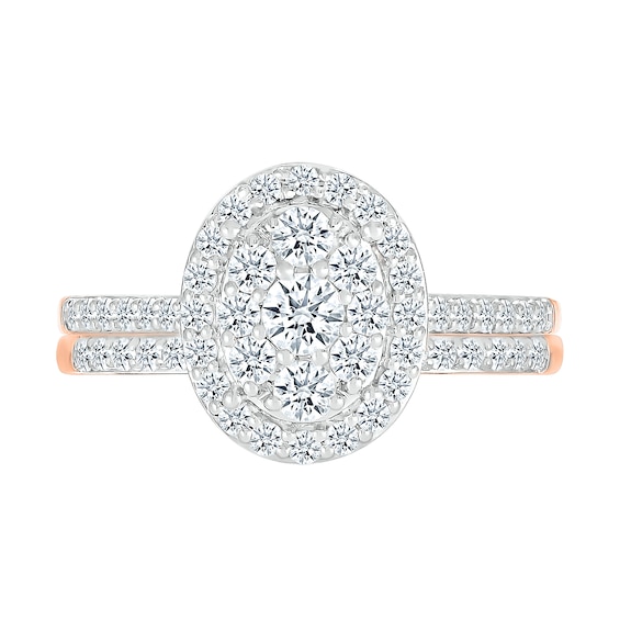 0.96 CT. T.W. Oval-Shaped Multi-Diamond Frame Bridal Set in 10K Rose Gold