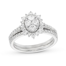 0.95 CT. T.W. Oval-Shaped Multi-Diamond Flower Frame Bridal Set in 10K White Gold (J/I3)