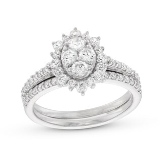0.95 CT. T.W. Oval-Shaped Multi-Diamond Flower Frame Bridal Set in 10K Gold (J/I3
