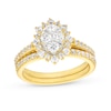 Thumbnail Image 1 of 0.95 CT. T.W. Oval-Shaped Multi-Diamond Flower Frame Bridal Set in 10K Gold (J/I3)