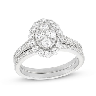 0.95 CT. T.W. Oval-Shaped Multi-Diamond Frame Bridal Set in 10K White Gold (J/I3)