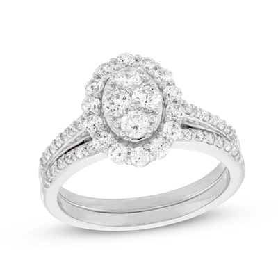 0.95 CT. T.W. Oval-Shaped Multi-Diamond Frame Bridal Set in 10K White Gold (J/I3)