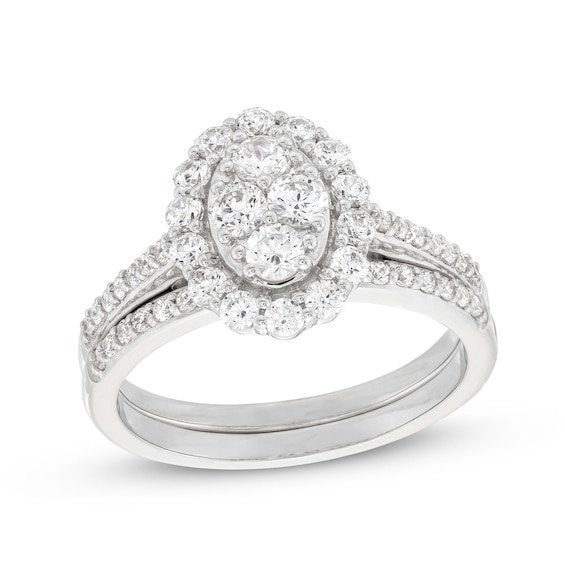 0.95 CT. T.W. Oval-Shaped Multi-Diamond Frame Bridal Set in 10K White Gold (J/I3)
