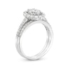 0.95 CT. T.W. Oval-Shaped Multi-Diamond Frame Bridal Set in 10K White Gold (J/I3)