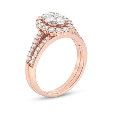 0.95 CT. T.W. Oval-Shaped Multi-Diamond Frame Bridal Set in 10K Rose Gold (J/I3)