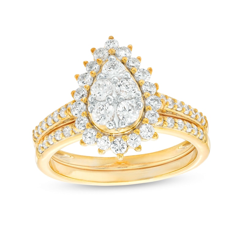Main Image 1 of 0.95 CT. T.W. Pear-Shaped Multi-Diamond Flower Frame Bridal Set in 10K Gold (J/I3)