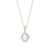 Oval Opal and 0.115 CT. T.W. Baguette and Round Diamond Starburst Frame Pendant in 10K Gold