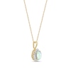 Oval Opal and 0.115 CT. T.W. Baguette and Round Diamond Starburst Frame Pendant in 10K Gold