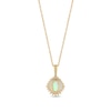 Oval Opal and 0.115 CT. T.W. Baguette and Round Diamond Starburst Frame Pendant in 10K Gold