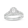 Thumbnail Image 0 of 0.95 CT. T.W. Oval Diamond Frame Bridal Set in 14K White Gold (I/I1)