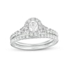 Thumbnail Image 1 of 0.95 CT. T.W. Oval Diamond Frame Bridal Set in 14K White Gold (I/I1)