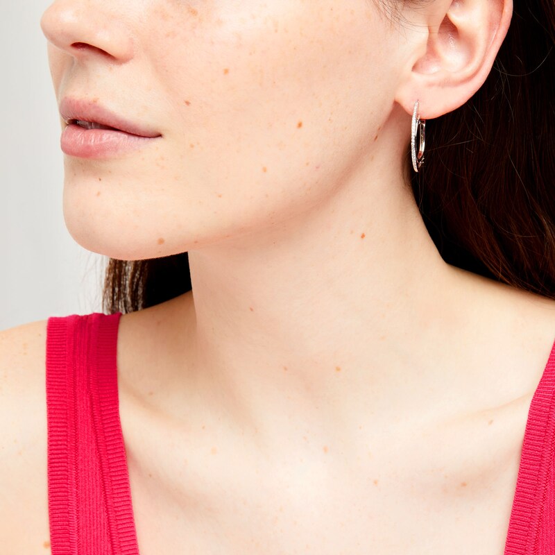 Main Image 2 of Unstoppable Love™ 0.10 CT. T.W. Diamond Line Illusion Hoop Earrings in Sterling Silver