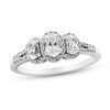 Thumbnail Image 1 of 0.95 CT. T.W. Oval Diamond Frame Three Stone Split Shank Engagement Ring in 14K White Gold (I/I1-SI2)
