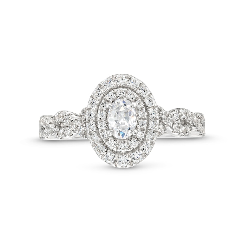 Vera Wang Love Collection Canadian Certified Oval Centre Diamond 0.69 CT. T.W. Twist Engagement Ring in 14K White Gold|Peoples Jewellers