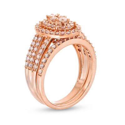 0.95 CT. T.W. Oval Multi-Diamond Triple Row Split Shank Bridal Set in 10K Rose Gold
