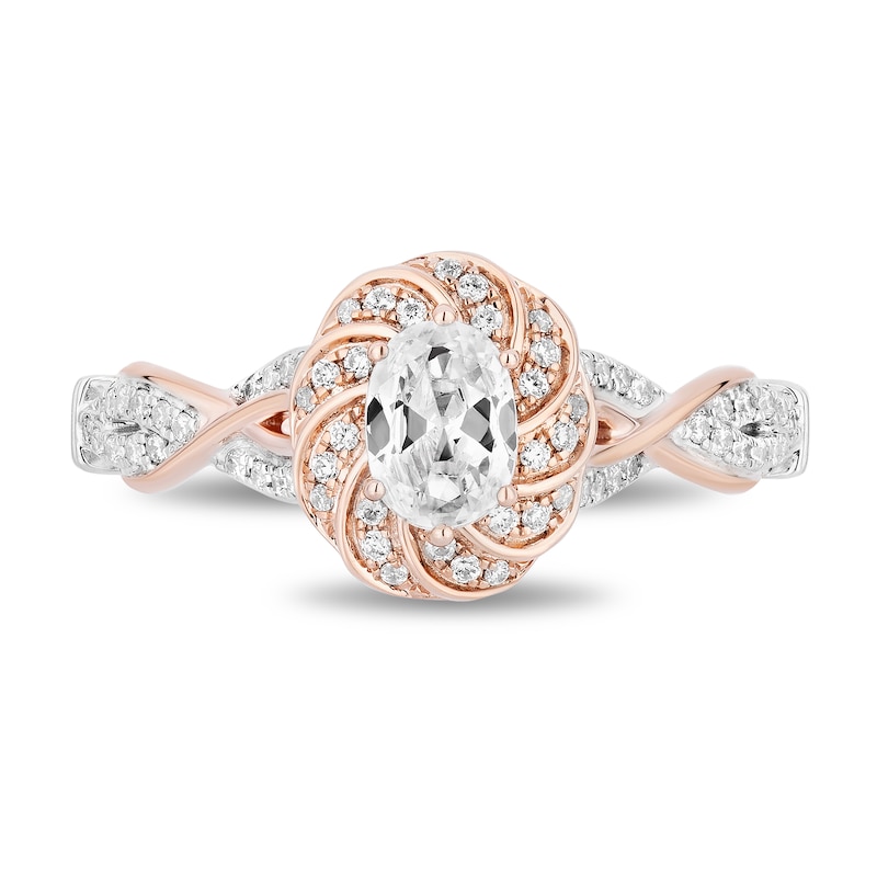 Enchanted Disney Rapunzel 0.69 CT. T.W. Oval Diamond Braid Frame Engagement Ring in 14K Two-Tone Gold (I/I1)