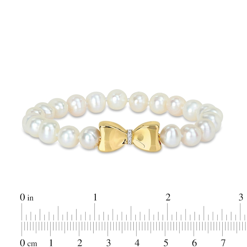 Main Image 2 of Eternally Bonded 7.0-7.5mm Freshwater Cultured Pearl Strand and 0.05 CT. T.W. Diamond Bow Stretch Bracelet with 10K Gold