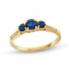 Thumbnail Image 0 of Blue Sapphire and 0.04 CT. T.W. Diamond Three Stone Ring in 10K Gold