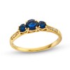 Thumbnail Image 0 of Blue Sapphire and 0.04 CT. T.W. Diamond Three Stone Ring in 10K Gold